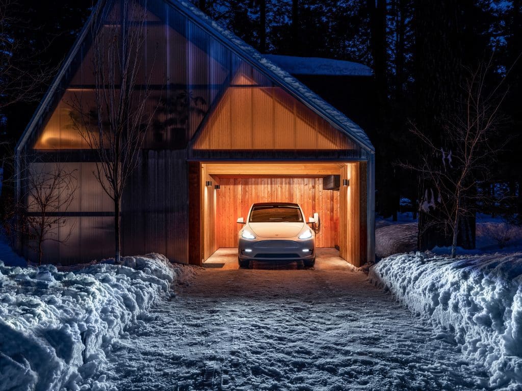A Tesla electric vehicle charging at home