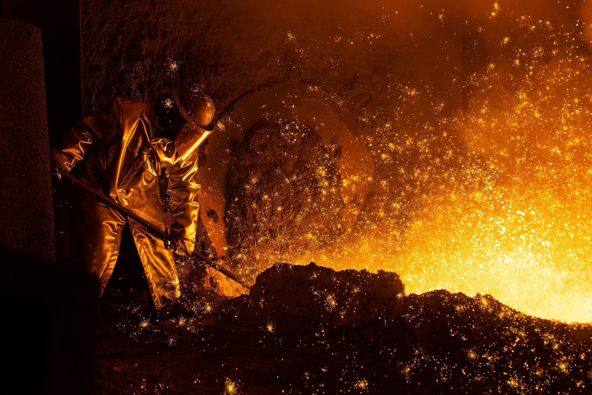 A worker in a high-heat industrial facility. Heavy industry is increasingly easy to decarbonise.